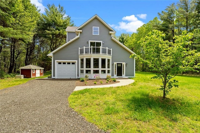 888 Plainfield Pike, Coventry, RI 02827 - view of front of home with a balcony, a front yard, driveway, and a garage