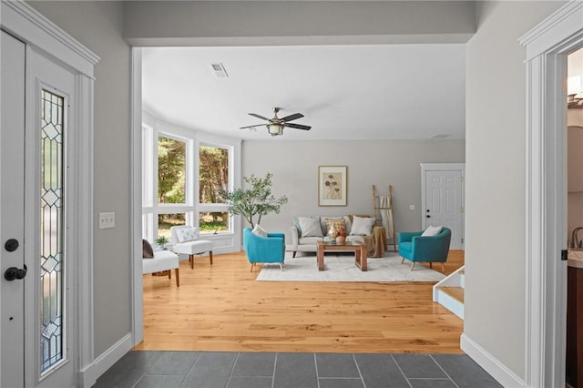 888 Plainfield Pike, Coventry, RI 02827 - foyer entrance featuring tile patterned flooring, a ceiling fan, and baseboards