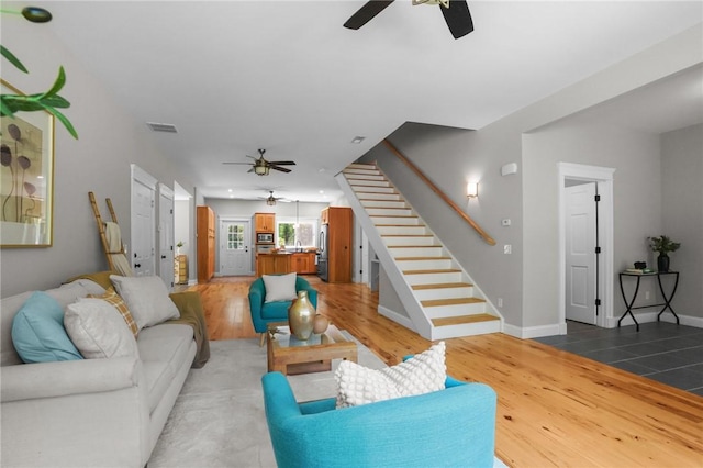888 Plainfield Pike, Coventry, RI 02827 - living room with ceiling fan, stairs, light wood finished floors, and baseboards