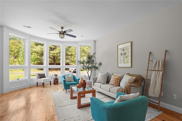 888 Plainfield Pike, Coventry, RI 02827 - living area with a ceiling fan, plenty of natural light, and light wood-style flooring