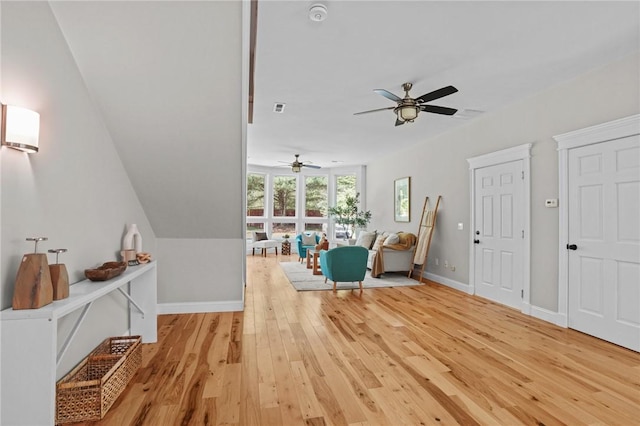 888 Plainfield Pike, Coventry, RI 02827 - living area featuring a ceiling fan, light wood finished floors, and baseboards