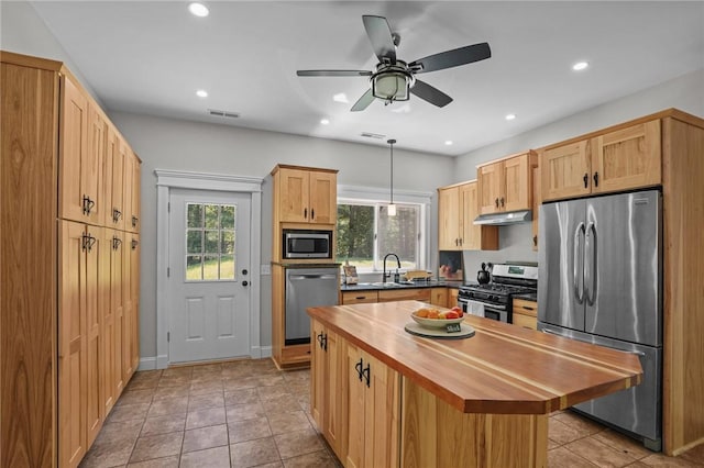 888 Plainfield Pike, Coventry, RI 02827 - kitchen featuring appliances with stainless steel finishes, wooden counters, under cabinet range hood, recessed lighting, and a sink