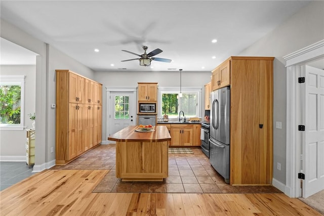888 Plainfield Pike, Coventry, RI 02827 - kitchen featuring appliances with stainless steel finishes, a sink, a ceiling fan, light wood finished floors, and recessed lighting