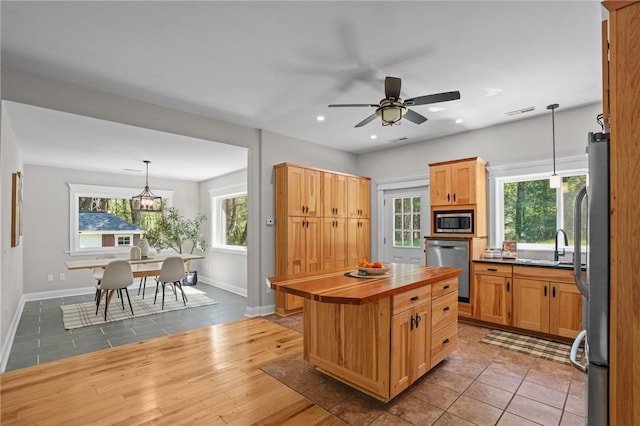 888 Plainfield Pike, Coventry, RI 02827 - kitchen with stainless steel appliances, baseboards, a ceiling fan, healthy amount of natural light, and recessed lighting