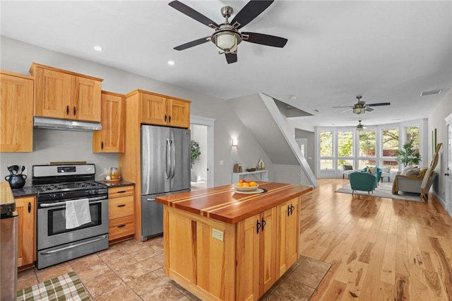 888 Plainfield Pike, Coventry, RI 02827 - kitchen with appliances with stainless steel finishes, under cabinet range hood, a ceiling fan, open floor plan, and a center island