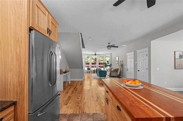 888 Plainfield Pike, Coventry, RI 02827 - kitchen with freestanding refrigerator, a ceiling fan, butcher block countertops, and baseboards