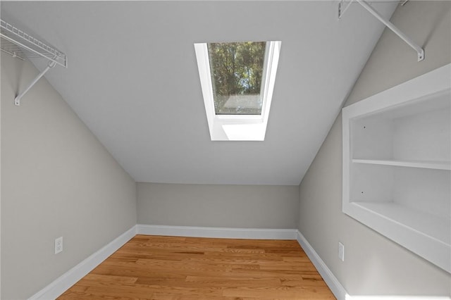 888 Plainfield Pike, Coventry, RI 02827 - bonus room featuring a skylight, light wood-style flooring, baseboards, and vaulted ceiling
