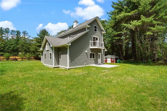 888 Plainfield Pike, Coventry, RI 02827 - back of house with a balcony, a chimney, a lawn, and a shingled roof