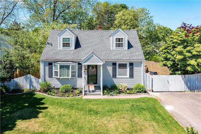 45 Nichols Rd, North Kingstown, RI 02852 - cape cod home featuring a chimney, a gate, and a shingled roof