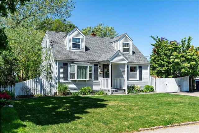 45 Nichols Rd, North Kingstown, RI 02852 - new england style home featuring roof with shingles, a chimney, covered porch, and a gate