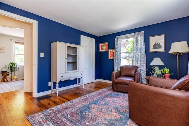 45 Nichols Rd, North Kingstown, RI 02852 - living room featuring wood-type flooring, plenty of natural light, and baseboards