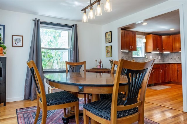 45 Nichols Rd, North Kingstown, RI 02852 - dining room featuring light wood-type flooring and baseboards
