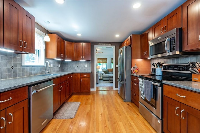 45 Nichols Rd, North Kingstown, RI 02852 - kitchen featuring stainless steel appliances, a sink, healthy amount of natural light, light wood-type flooring, and recessed lighting