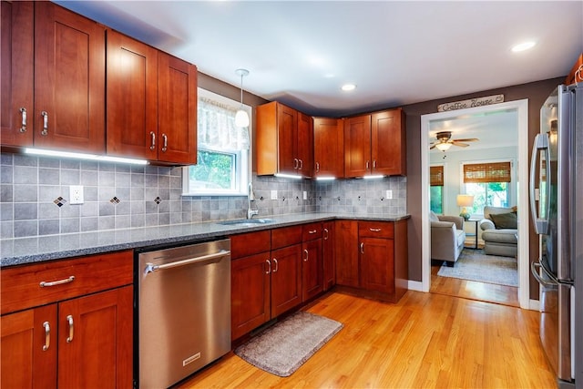 45 Nichols Rd, North Kingstown, RI 02852 - kitchen with stainless steel appliances, light wood-style floors, a ceiling fan, dark stone counters, and recessed lighting