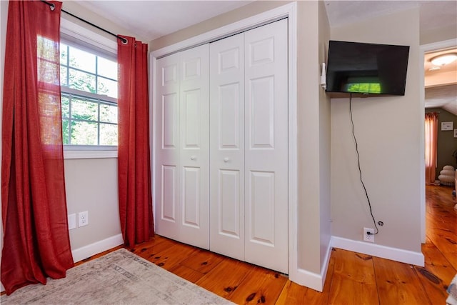 45 Nichols Rd, North Kingstown, RI 02852 - unfurnished bedroom with baseboards, wood finished floors, and a closet