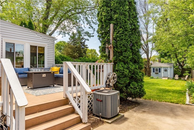 45 Nichols Rd, North Kingstown, RI 02852 - wooden deck featuring central AC, outdoor lounge area, a yard, an outdoor structure, and view of wooded area