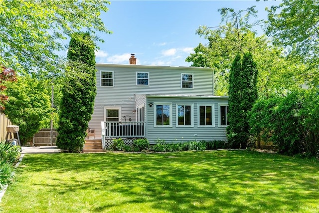 45 Nichols Rd, North Kingstown, RI 02852 - rear view of house featuring a chimney and a deck