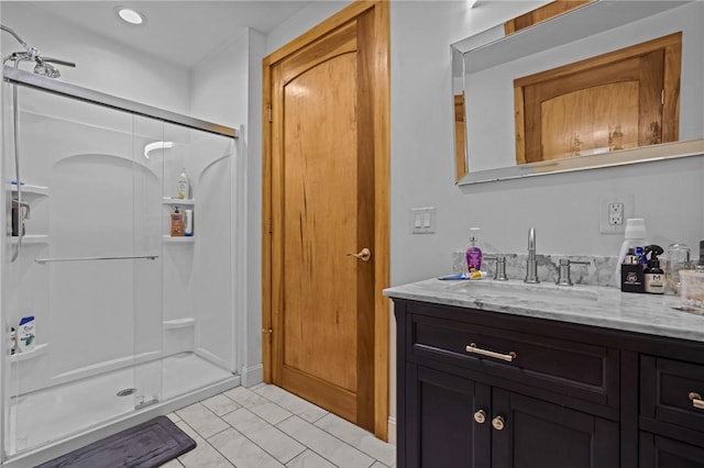 1117 Douglas Ave Unit 120, North Providence, RI 02904 - bathroom featuring a shower stall, vanity, marble look tiles, and recessed lighting