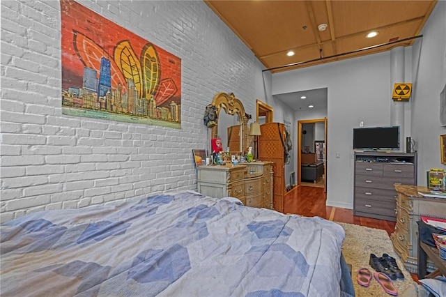 1117 Douglas Ave Unit 120, North Providence, RI 02904 - bedroom featuring recessed lighting, wood finished floors, brick wall, and baseboards