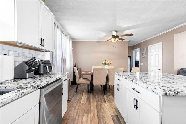37 Boundary Ave, Providence, RI 02909 - kitchen with dishwasher, light wood-style flooring, ceiling fan, backsplash, and white cabinets