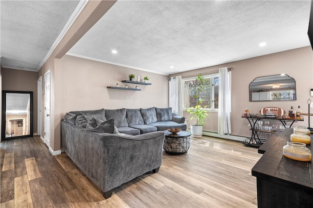 37 Boundary Ave, Providence, RI 02909 - living area featuring a textured ceiling, ornamental molding, recessed lighting, wood finished floors, and baseboard heating