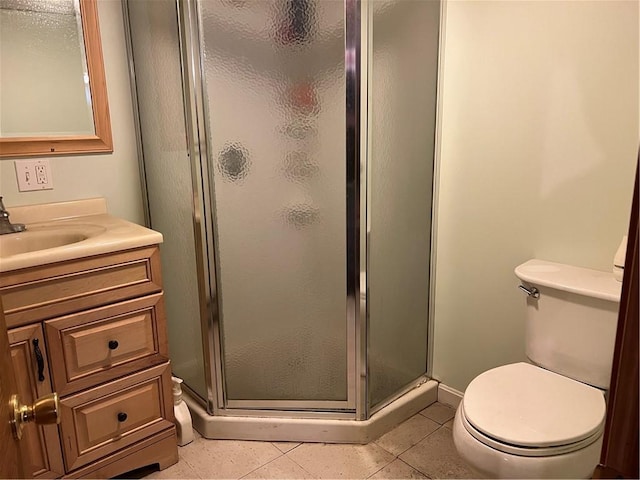 49 Nathaniel Ave, Pawtucket, RI 02860 - bathroom featuring a stall shower, toilet, tile patterned flooring, vanity, and baseboards