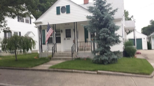 49 Nathaniel Ave, Pawtucket, RI 02860 - bungalow with a porch, a front lawn, and a chimney