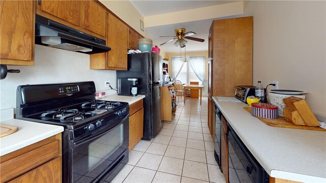 49 Nathaniel Ave, Pawtucket, RI 02860 - kitchen with black appliances, under cabinet range hood, a ceiling fan, light countertops, and brown cabinetry
