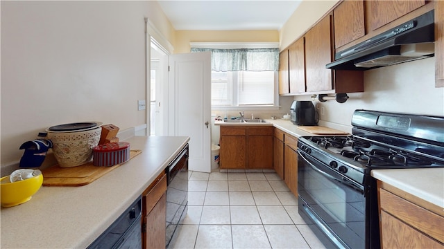 49 Nathaniel Ave, Pawtucket, RI 02860 - kitchen with black appliances, under cabinet range hood, light countertops, and brown cabinets