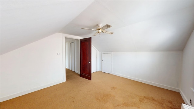 49 Nathaniel Ave, Pawtucket, RI 02860 - additional living space with light colored carpet, vaulted ceiling, baseboards, and ceiling fan