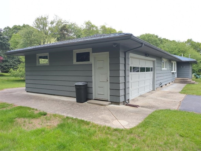 13 Ivy Pl, Lincoln, RI 02865 - view of outdoor structure featuring an attached garage and driveway