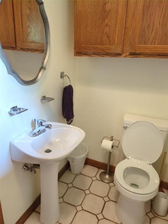 13 Ivy Pl, Lincoln, RI 02865 - half bathroom featuring toilet and baseboards