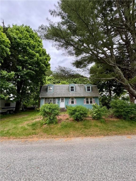 74 Cedar Rd, Charlestown, RI 02813 - view of front facade featuring a gambrel roof and roof with shingles