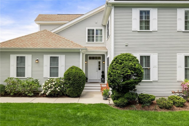 83 Preservation Way S, Kingstown, RI 02879 - view of front facade featuring a front lawn and roof with shingles