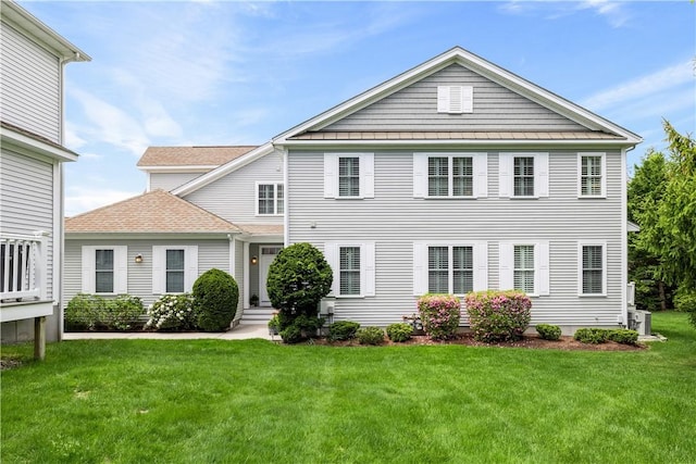 83 Preservation Way S, Kingstown, RI 02879 - view of front of house with a front yard and a standing seam roof