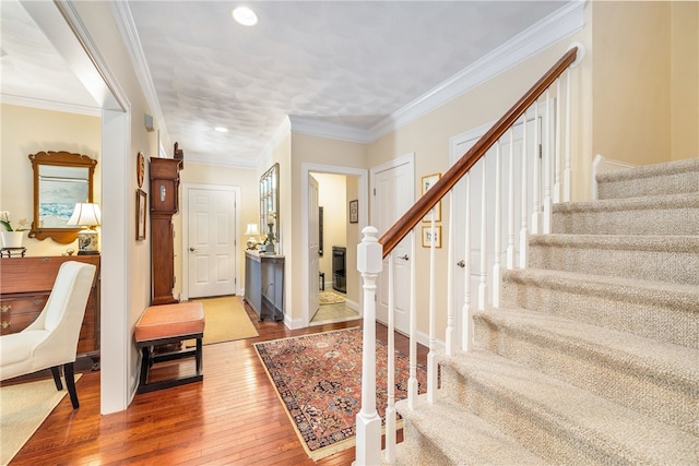 83 Preservation Way S, Kingstown, RI 02879 - entryway featuring hardwood / wood-style flooring, stairway, ornamental molding, and recessed lighting