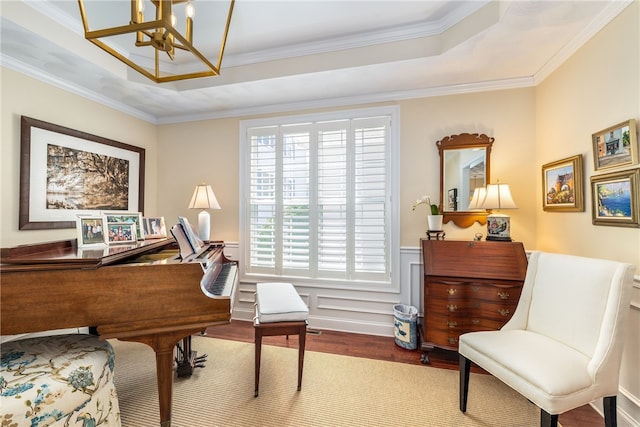 83 Preservation Way S, Kingstown, RI 02879 - sitting room featuring a chandelier, wood finished floors, a wainscoted wall, crown molding, and a tray ceiling