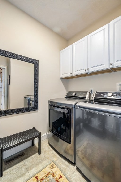 83 Preservation Way S, Kingstown, RI 02879 - laundry room featuring cabinet space, washer and dryer, baseboards, and light tile patterned floors