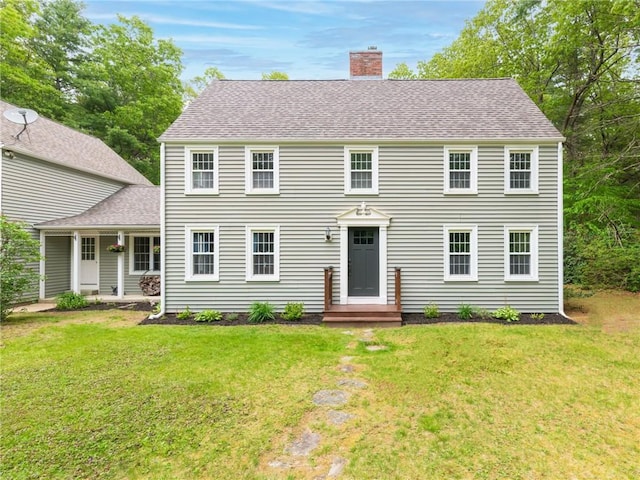 12 Rustic Acres Dr, Glocester, RI 02814 - colonial house featuring a chimney, a front yard, and roof with shingles
