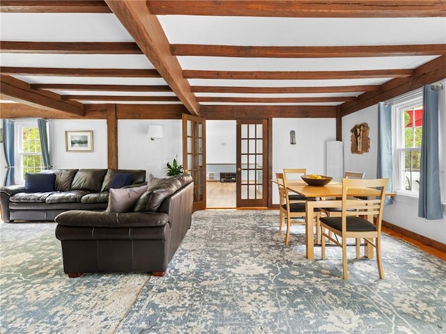 12 Rustic Acres Dr, Glocester, RI 02814 - living area with french doors, healthy amount of natural light, and beam ceiling