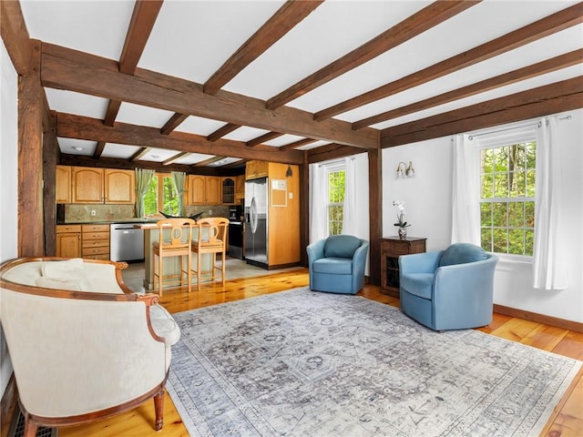 12 Rustic Acres Dr, Glocester, RI 02814 - living area featuring plenty of natural light, beamed ceiling, light wood-style flooring, and baseboards