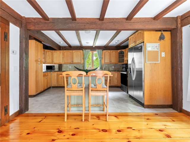 12 Rustic Acres Dr, Glocester, RI 02814 - kitchen featuring stainless steel fridge, beamed ceiling, range with electric cooktop, decorative backsplash, and a kitchen island