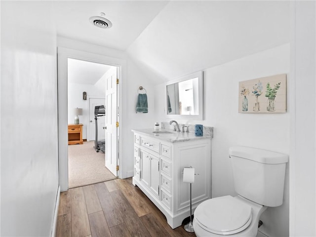 12 Rustic Acres Dr, Glocester, RI 02814 - bathroom featuring vanity, wood finished floors, toilet, and lofted ceiling