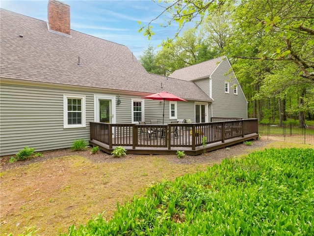12 Rustic Acres Dr, Glocester, RI 02814 - rear view of property with roof with shingles, a deck, and a chimney