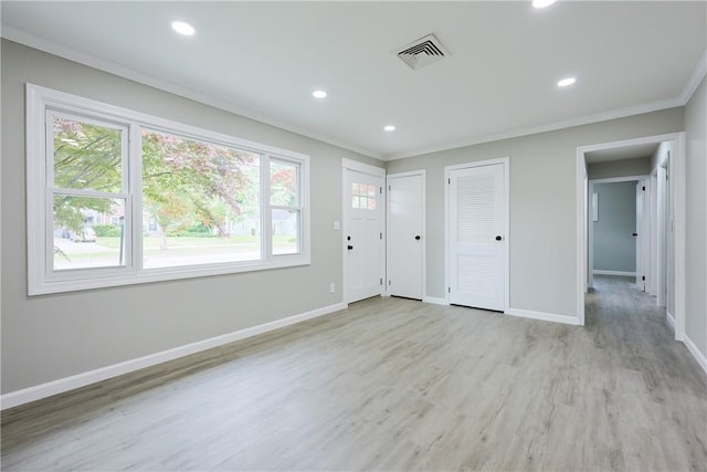 31 Forbes St, East Providence, RI 02915 - foyer entrance featuring crown molding, light wood-type flooring, baseboards, and recessed lighting