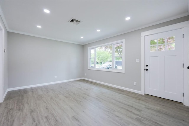 31 Forbes St, East Providence, RI 02915 - foyer entrance featuring ornamental molding, healthy amount of natural light, baseboards, recessed lighting, and wood finished floors
