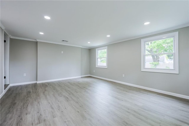 31 Forbes St, East Providence, RI 02915 - empty room featuring ornamental molding, recessed lighting, baseboards, and wood finished floors