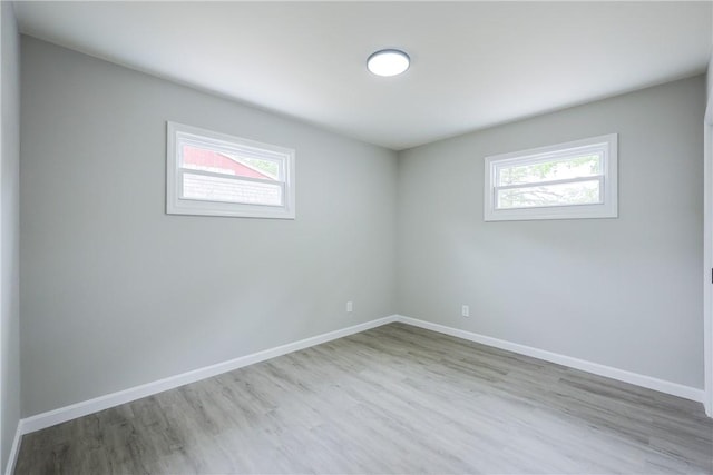 31 Forbes St, East Providence, RI 02915 - unfurnished room with plenty of natural light, wood finished floors, and baseboards