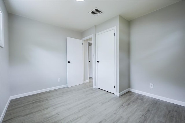 31 Forbes St, East Providence, RI 02915 - unfurnished bedroom with wood finished floors and baseboards