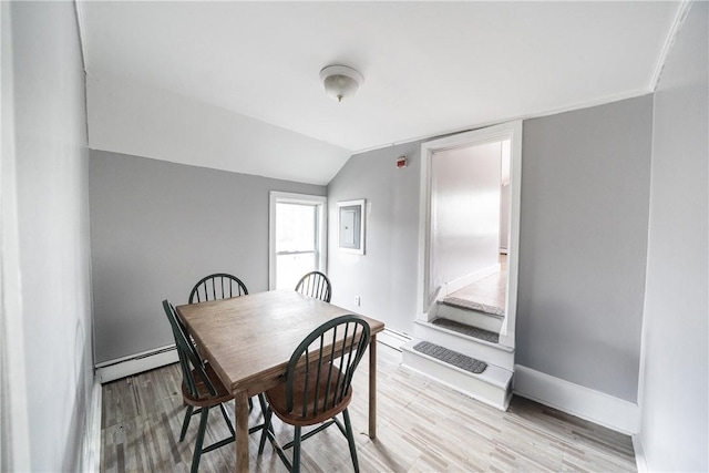 1 Spring St, Hopkinton, RI 02832 - dining room featuring baseboard heating, wood finished floors, lofted ceiling, and baseboards